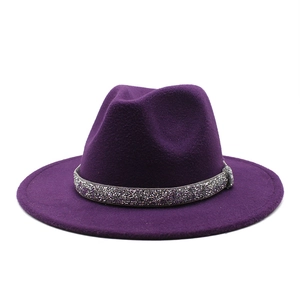 Macro shot of purple wool felt fedora with sparkling rhinestone crystal embellishment
