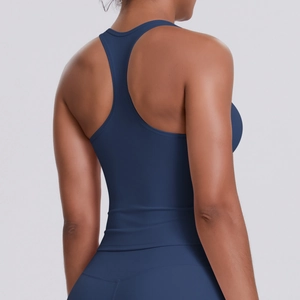 Detail view of the racerback design on a navy blue tight-fitting women's sports vest