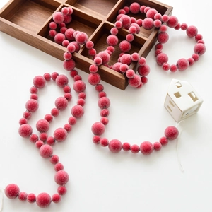 Frosted red berry garland with snowy texture for Christmas tree and festive home decoration