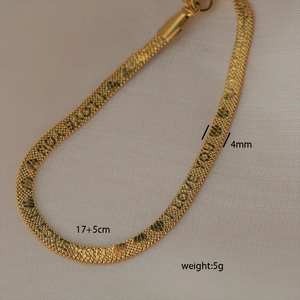 Detail shot of a 4mm gold-plated stainless steel herringbone anklet with size specs