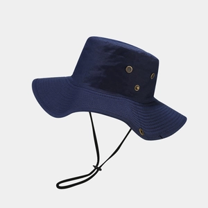 Detail of dark blue outdoor sun hat featuring brass ventilation eyelets and windproof drawstring