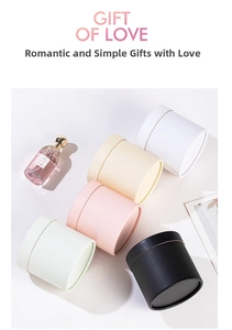 Minimalist cylindrical gift boxes in white pink and black for luxury flower arrangements