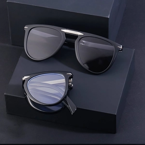 Foldable vintage aviator sunglasses in black with metallic accents and UV protection