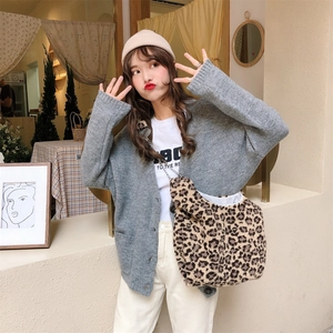 Chic leopard print plush shoulder bag styled with a grey cardigan and white casual outfit