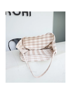 Detail of checkered canvas tote bag interior showing the spacious inner pocket design