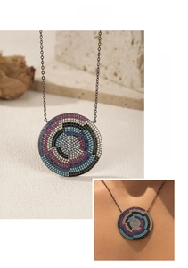 Detail of S925 silver pixelated shield pendant with multicolor micro-pave crystals