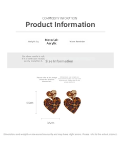 Detail view of heart-shaped leopard print earrings with size and material information