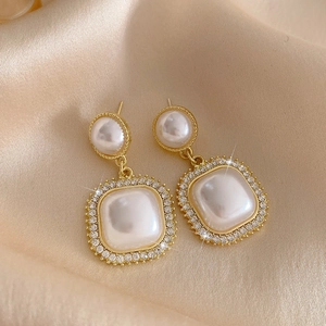 French vintage style pearl earrings with golden frame and sparkling crystal accents
