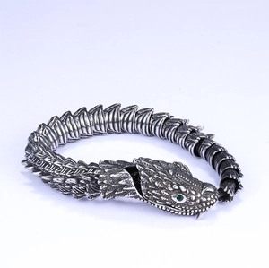3D silver snake bracelet with green stone eyes and detailed stainless steel scales
