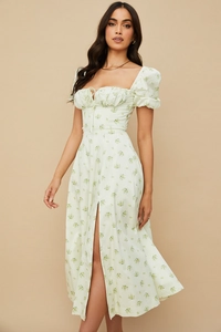 Detail of floral puff sleeve maxi dress featuring elegant front slit and waist tie