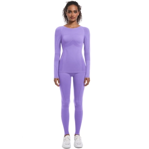 Completo sportivo senza cuciture lilla da donna con maglia a maniche lunghe e leggings