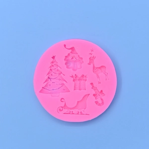 Pink circular silicone Christmas mold featuring a Santa, reindeer, and tree for DIY baking