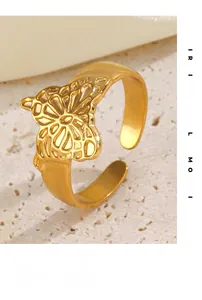 Macro shot of gold butterfly ring with intricate hollow texture and adjustable band