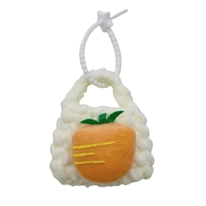 Handmade knitted mini fruit coin purse in cream white with a bright orange carrot ornament