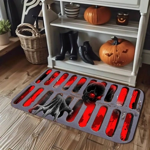 Detail showing the red-eyed skull design on a gray diatom mud Halloween mat