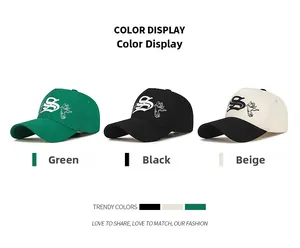 Detailed view of 5-panel baseball caps in green, black, and beige with pigeon embroidery