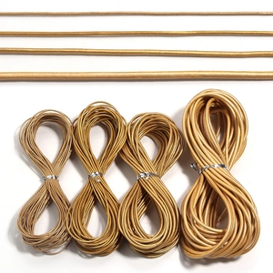 Detail showing four sizes of champagne gold leather cords for DIY jewelry making