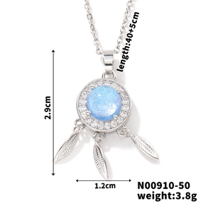 Detailed view of silver dreamcatcher necklace with blue stone and feathers, size 2.9x1.2cm