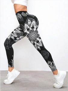 Close-up of high waist yoga leggings with mandala print and push-up effect on model