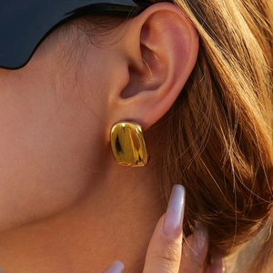 Polished 18k gold stainless steel rectangular stud earrings on female model