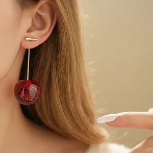 Elegant cherry stud earrings with red glitter resin and gold needles for women