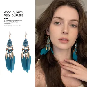 Bohemian feather tassel earrings with ethnic beads and teardrop design for women