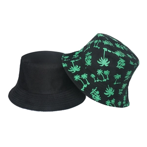 Set of two bucket hats including classic black and palm tree print for outdoor sun protection