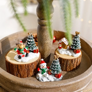 Handcrafted resin Christmas set featuring miniature elk, snowman and tree on wood base