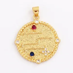Macro shot of 25mm gold coin pendant with Love and Freedom engraving and colored stones
