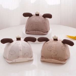 Detailed view of breathable cotton baby bear hats in brown, beige, and pink colors