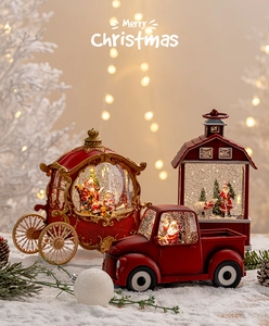Luminous red Christmas snow globe truck and lantern ornaments on festive snow background