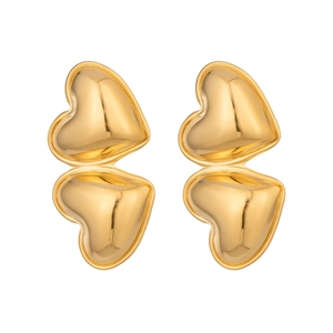 Macro shot of vertical double heart stud earrings with a polished gold finish texture