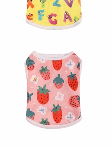 Detail view of breathable pet vests with strawberry and letter prints on a white backdrop