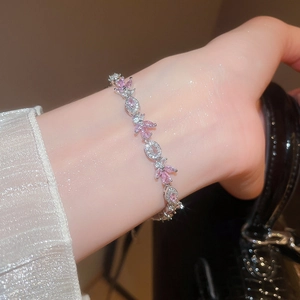 Close-up of elegant silver leaf bracelet with pink and white cubic zirconia stones