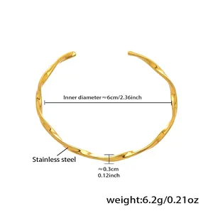 Detailed view of gold stainless steel knot bangle with 6cm inner diameter measurements