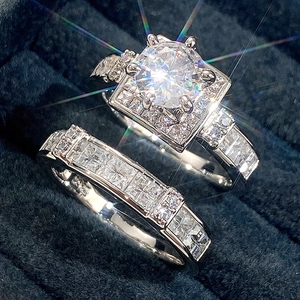 Silver square zircon bridal ring set with halo design in a blue velvet jewelry box