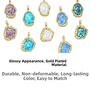 Detail of colorful irregular gemstone pendants with gold-plated frames and vibrant textures