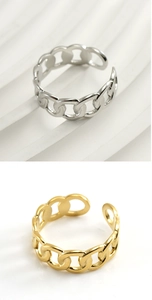 Detail of adjustable chain link rings in gold and silver stainless steel finish