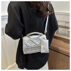 Silver quilted crossbody bag with floral embroidery and detachable coin purse detail