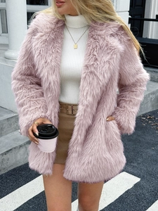 Elegant pink faux fur coat for women, mid-length plush jacket over a white sweater