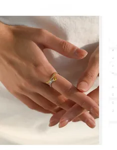 Detail of S925 silver double interlaced ring with pavé yellow and white crystals