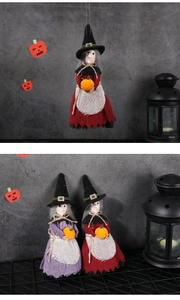 Detailed view of hanging Halloween witch dolls in red and purple fabric outfits