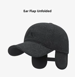 Detail of unfolded ear flaps on winter grey baseball cap with embroidery for warmth