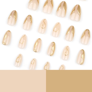 Short almond press-on nails in nude with 3D irregular gold metallic line designs