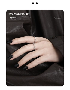 Detailed view of two stacked S925 silver rings with vine texture and zircon inlays