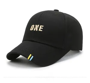 Detail view of cotton baseball cap showing side profile and ONE embroidery with brim stripes