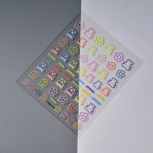 Detailed macro view of 5D embossed bear and flower nail art stickers FEB-814