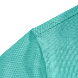 Macro shot of lake blue mesh fabric texture and double-stitched seam on a men's polo shirt