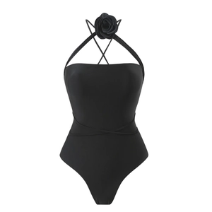 Detail of black one-piece swimsuit featuring a 3D rose choker and strappy waist design