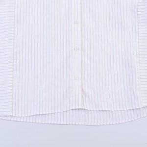 Women's loose white striped shirt with button placket and curved hem in flat lay view